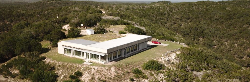 The Brutalist House Near Leakey Texas and the Three Sisters.